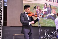 Master’s degree student of the Chemistry Faculty Farid Mamedov playing the violin on the stage of Baku Branch of Lomonosov Moscow State University